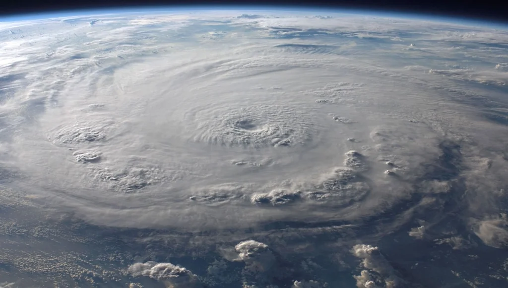 aerial view of Earth with a massive swirling hurricane, 